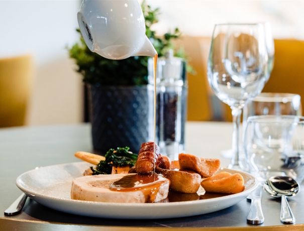 Roast British Turkey, Sage And Onion Stuffing, Pigs In Blankets, Winter Jus Gravy Pour